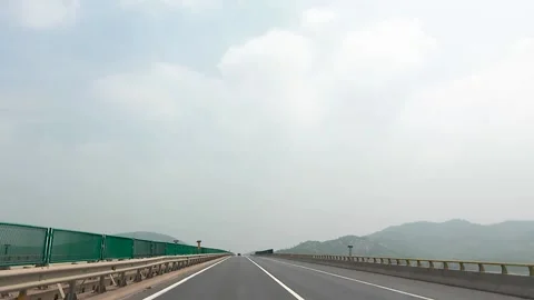 Driving a car on the highway Stock Footage 153658406
