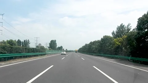 Driving a car on the highway Stock Footage 153660364