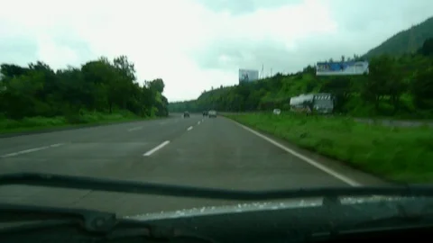Driving car on highway in monsoon, driver POV view mumbai Pune Expressway india Stock Footage 105639341