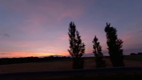 Driving with car on highway, sunset, driver view to the side Stock Footage 110901206