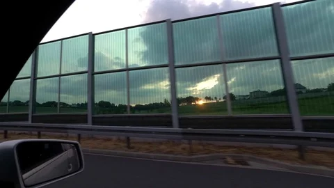 Driving with car on highway, sunset, driver view to the side Stock Footage 110901795