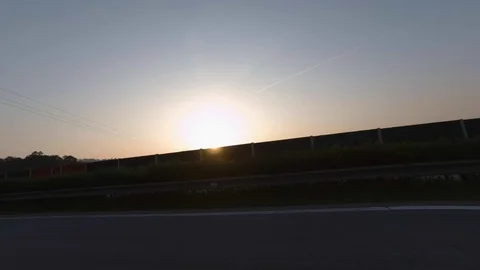 Driving with car on highway, sunset, driver view to the side Stock Footage 110960145