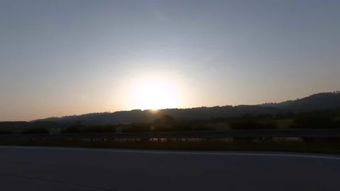 Driving with car on highway, sunset, driver view to the side Stock Footage 110985638