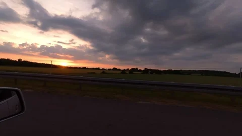 Driving with car on highway, sunset, driver view to the side Stock Footage 110989099