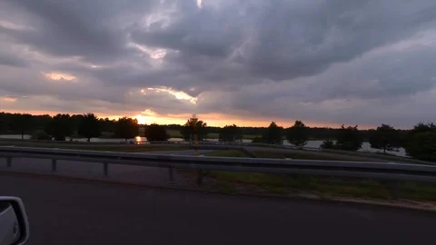 Driving with car on highway, sunset, driver view to the side 스톡 동영상 110989431