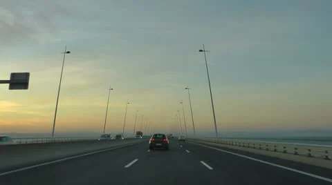 Driving car in highway at sunset Stock Footage 8960433