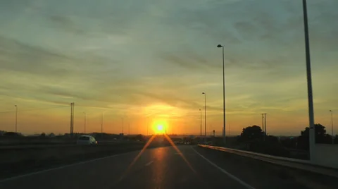 Driving car in highway at sunset Stock Footage 34737639