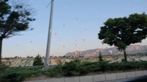Driving a car inside the cappadocia by hot air balloon Video stock 171012993
