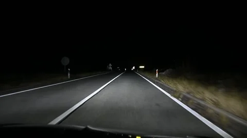 Driving a car at night. Driver's view on the asphalt road. Stock Footage 296892641