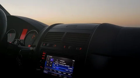 Driving a car at night. Inner view with hand wheel and lighting dashboard. Vídeos de archivo 105792234