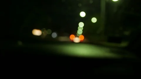 Driving car at night - out of focus concept footage - bokeh light circles Stock Footage 93949385