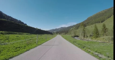 Driving a Car on oneway road in Austrian alps with beautiful landscape view Stock Footage 98533272