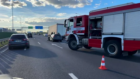 Driving car past road accident in Kaunas city Lithuania 库存影片 252140262