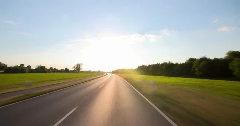 Driving a car - POV - Sunny Road Stock Footage