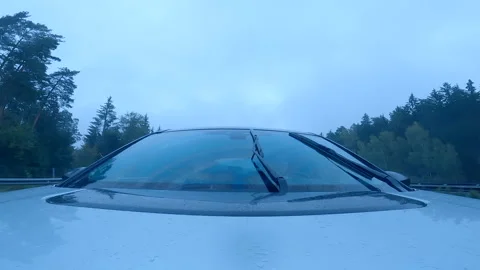 Driving car in a rain on a highway Stock Footage 214035629