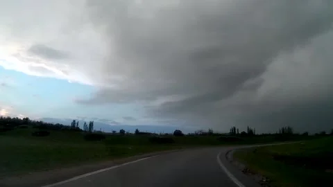 Driving car in rain, windshield with wipers Stock Footage 130973152