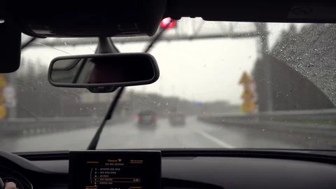 Driving car in the rain with the wipers on Stock Footage 78605042