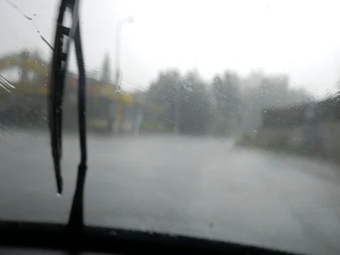 Driving car in a rainy day Stock Footage 77573787
