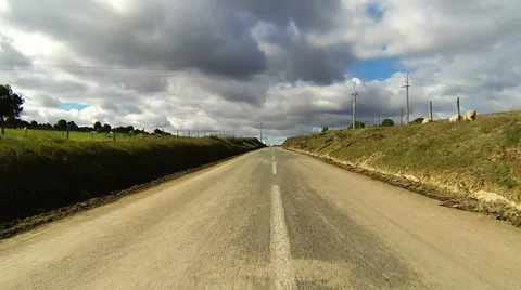 Driving car on the road in green fields Stock Footage 34547027