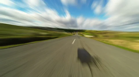 Driving car on the road in green fields, blurred timelapse 4K 스톡 동영상 34549247