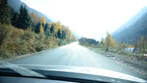 Driving on the Car on the Road to the Mountains 스톡 동영상 103801995