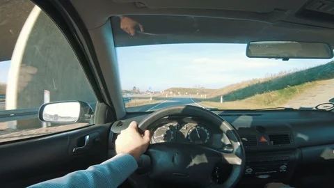 Driving car into roundabout seen from the drivers perspective Stock Footage 98687632
