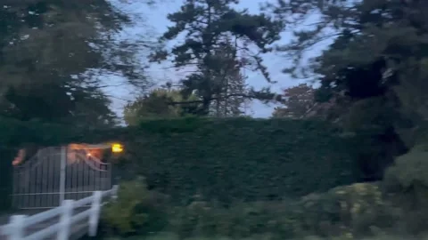 Driving Car Side View Through Neighbourhood Evening Motion Stock Footage 219641776