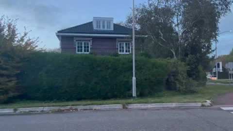 Driving Car Side View Through Neighbourhood Over Roundabout Motion Stock Footage 219641809