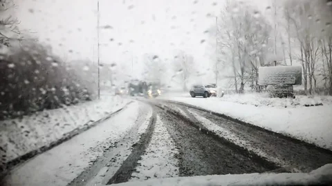 Driving a car as the snow is falling Stock Footage 88494106