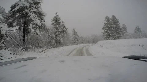 Driving car in snow storm Stock Footage 82367212