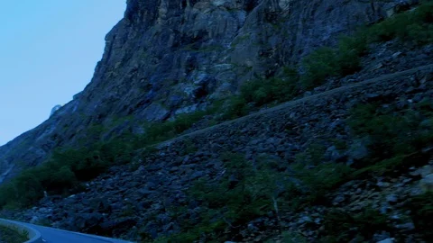 Driving in a car up switchbacks on steep mountain road in Norway. Stock Footage 117402067