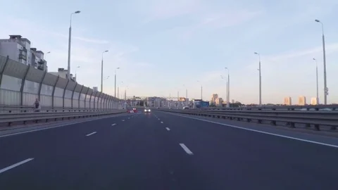 Driving a car through the evening city. Cars are driving on the highway in th Stock Footage