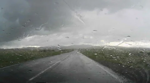 Driving a car through heavy rain Video stock 62770743