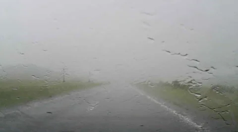 Driving a car through heavy rain Video stock 62770825