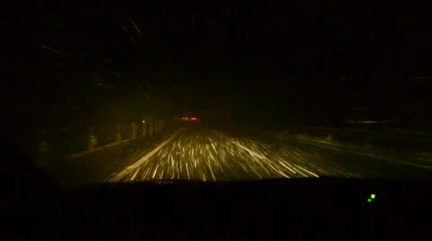 Driving with a car through heavy snow fall in Japan at night Stock Footage 12452288