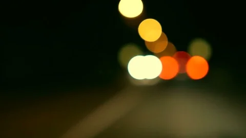 Driving a car through night road, highway. Defocused lights Los Angeles stree Stock Footage 83196606