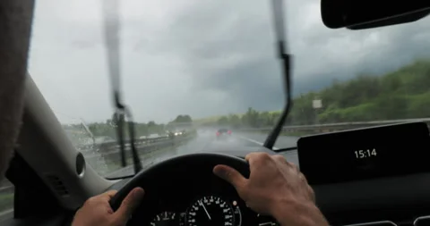 Driving car through rain with windshield wipers on Stock Footage 265239842