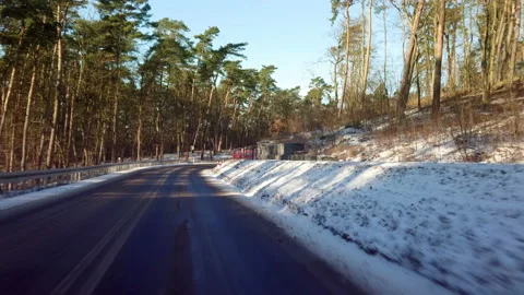 Driving a car through the winter forest Stock Footage 169469602