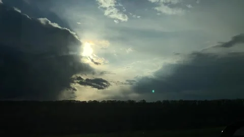Driving a car in thunderstorm during the sunset. Stock Footage 310265957