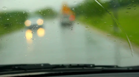Driving car while raining outside on wet road with traffic, shallow DOF Stock Footage 38072093