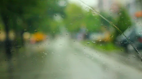 Driving car while raining though town with traffic, shallow DOF Stock Footage 38078707