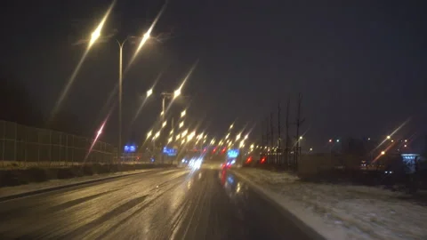 Driving a car with windshield wipers on at night in winter Stock-Footage 237350276