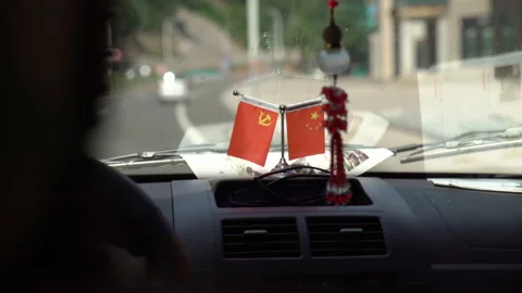 Driving with China flag Stock Footage 130351451