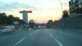 Driving city street time-lapse at dusk, cars lights on HD Footage