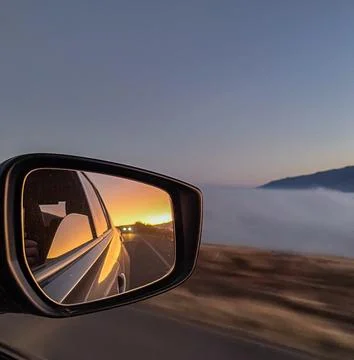 Driving close to the clouds on a winter sunset in the Calchaquies Valleys. Stock Photos