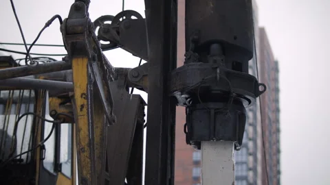 Driving concrete pile with piling rig at construction site Stock Footage 327041525