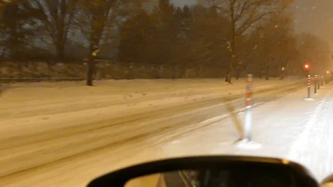 Driving in construction zone during snowfall Stock Footage 125549243