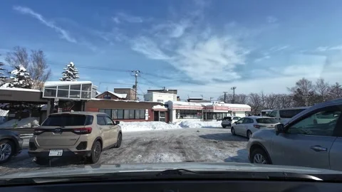 Driving into crowded service area parking lot in snowy Hokkaido Stock Footage 333229890