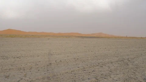 Driving Dacia Duster in Morocco desert, high dunes in background, Africa in 4K Stock Footage 92056478