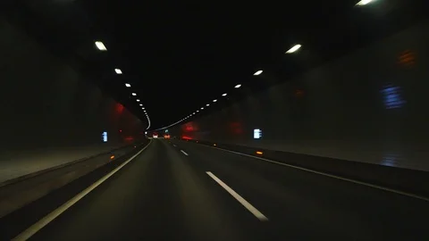 Driving in the dark tunnel Vídeo Stock 92568942